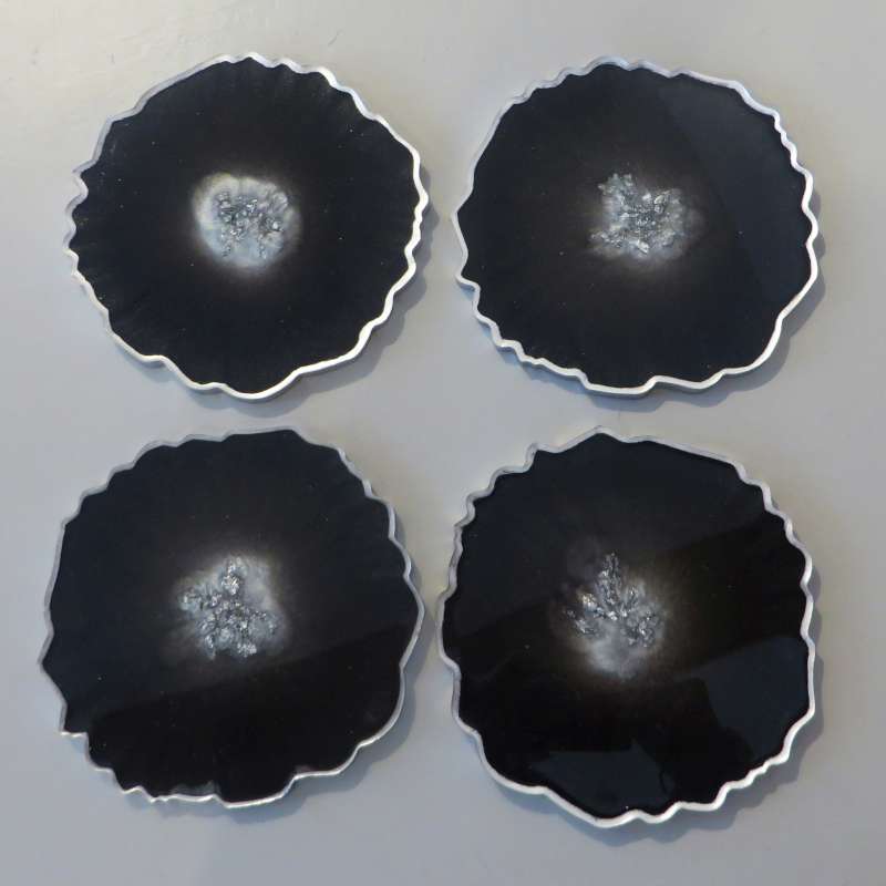 Black and silver round coasters